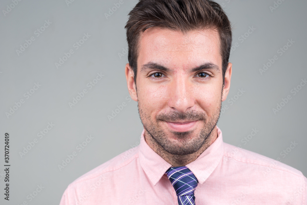 Portrait of young handsome Hispanic businessman against white background Portrait of young handsome Hispanic businessman against white background