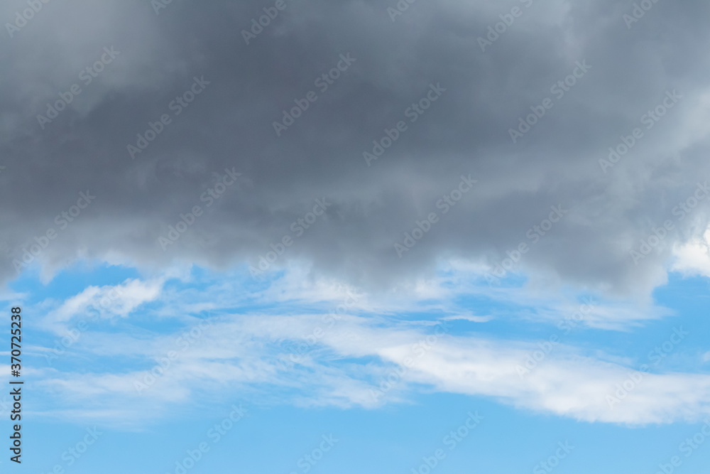 Dark rain cloud above the blue sky Dark rain cloud above the blue sky