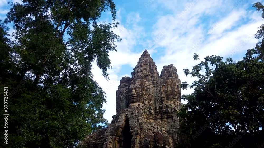 Time lapse showing moving clouds with changing light over the largest religious monument in the world, Angkor Wat temple, Cambodia. Time lapse showing moving clouds with changing light over the largest religious monument in the world, Angkor Wat temple, Cambodia.