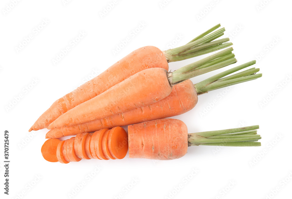 Whole and cut ripe carrots isolated on white, top view Whole and cut ripe carrots isolated on white, top view