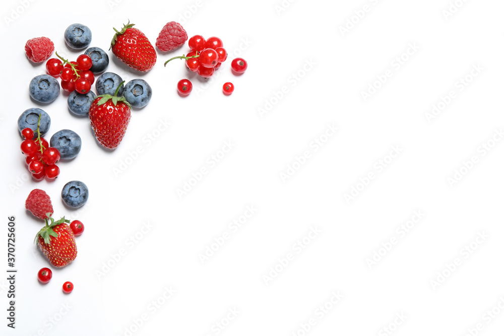 Mix of fresh berries on white background, flat lay Mix of fresh berries on white background, flat lay