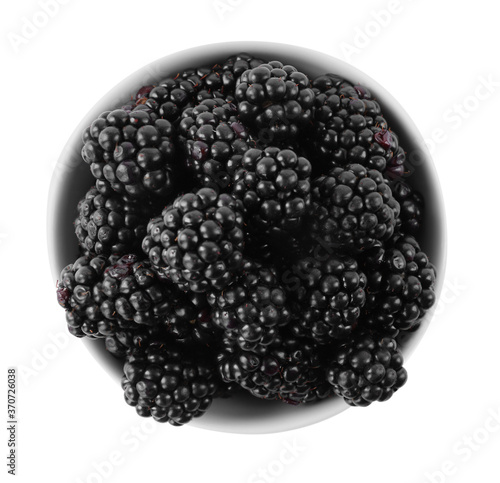 Fresh ripe blackberries in bowl isolated on white, top view