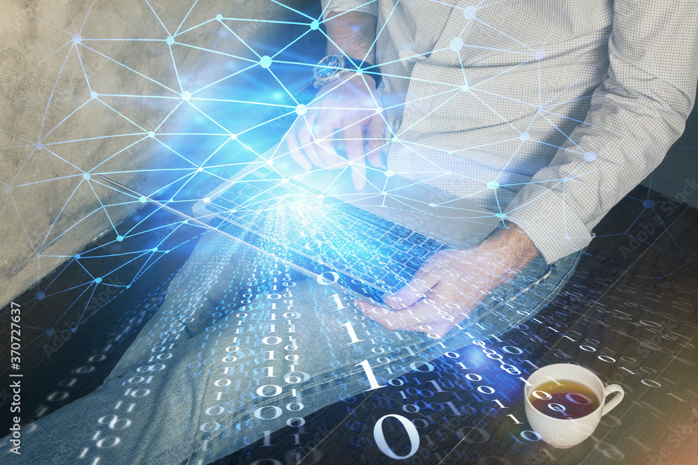 Multi exposure of data internet theme hologram with man working on computer on background. Concept of innovation. Multi exposure of data internet theme hologram with man working on computer on background. Concept of innovation.