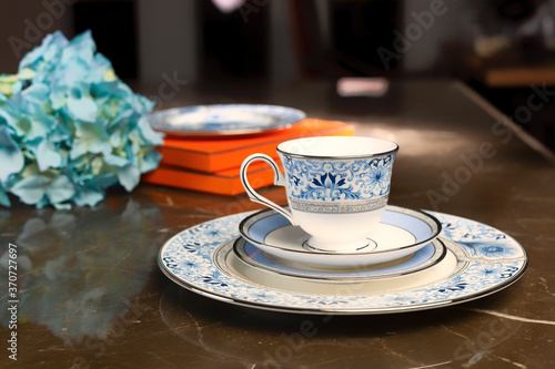 antique porcelain plate and cup on the table