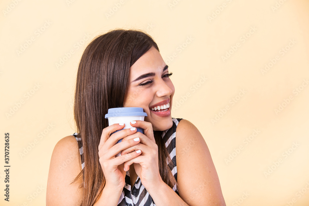 Coffee lover concept. Closeup photo portrait of delightful cheerful positive with toothy beaming smile person holding cup of warm latte in hands cuddling to herself isolated bright color background Coffee lover concept. Closeup photo portrait of delightful cheerful positive with toothy beaming smile person holding cup of warm latte in hands cuddling to herself isolated bright color background