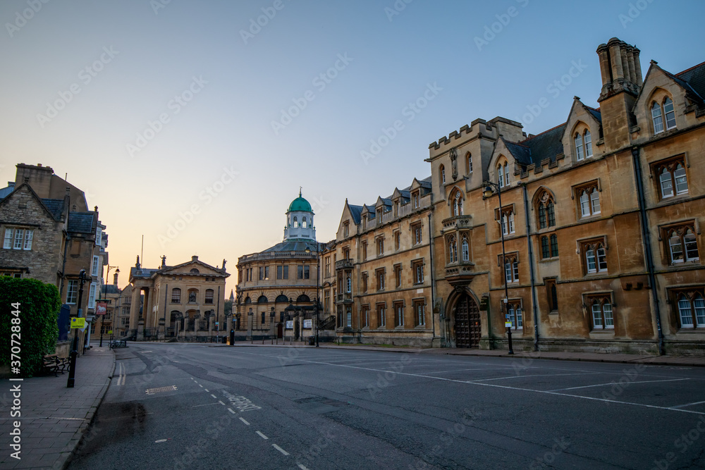 The Clarendon Building, The Sheldonian Theatre and Exeter College lining Broad Street in Oxford with no people or vehicles. Early in the morning. Oxford, England, UK.