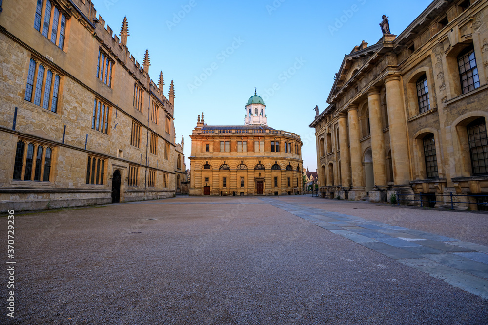 The side of the Sheldonian Theatre and the Clarendon Building with no people around, early in the morning. Oxford, England, UK.