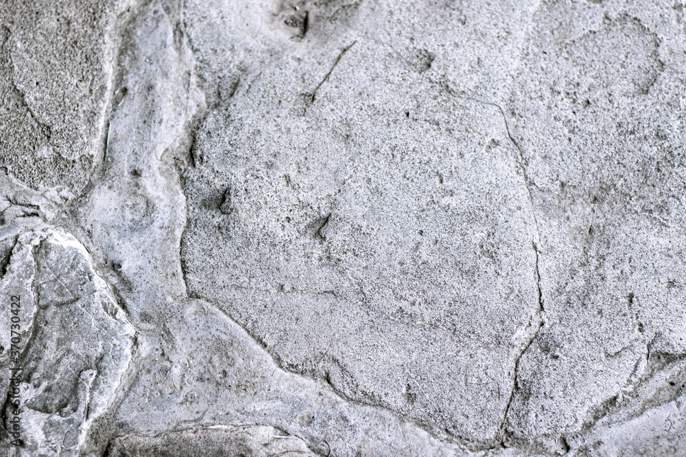 Fototapeta premium Natural stone distressed and shabby surface. Rock background with scratched texture.