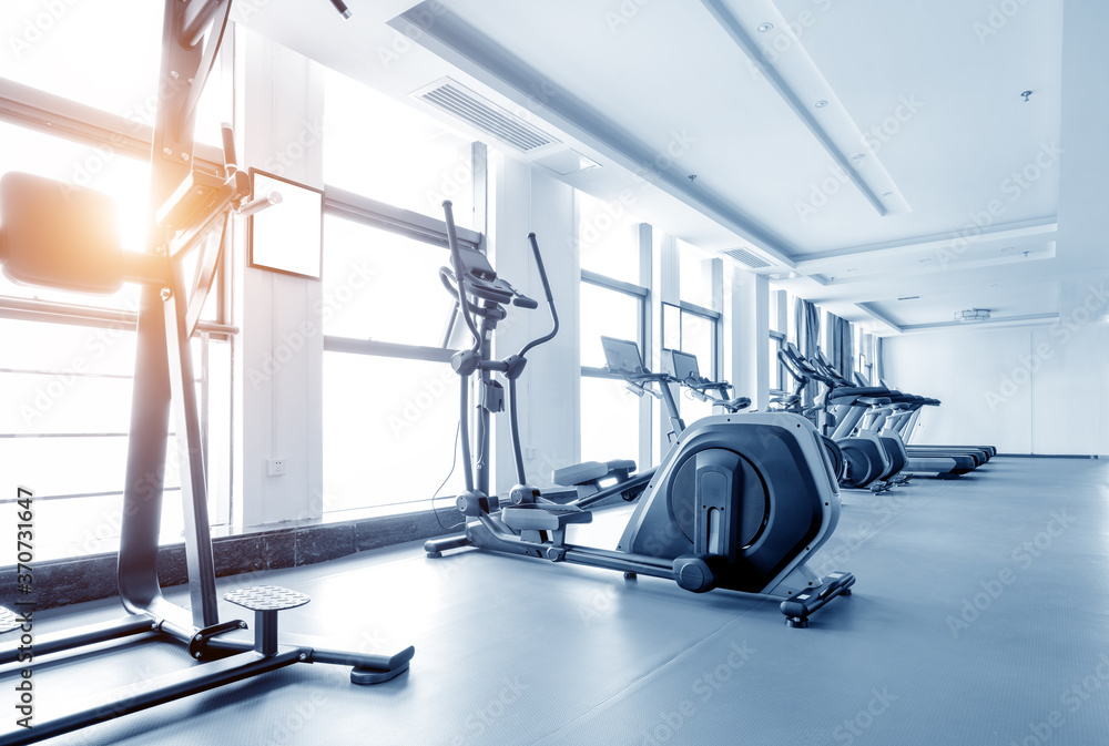 Fototapeta premium Healthy lifestyle concept. Spinning class with empty bikes. fitness, sport, training