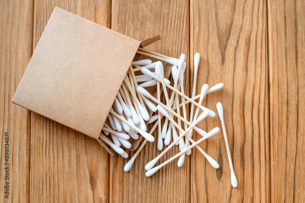 Wooden cotton buds. View from above. Wood background Wooden cotton buds. View from above. Wood background