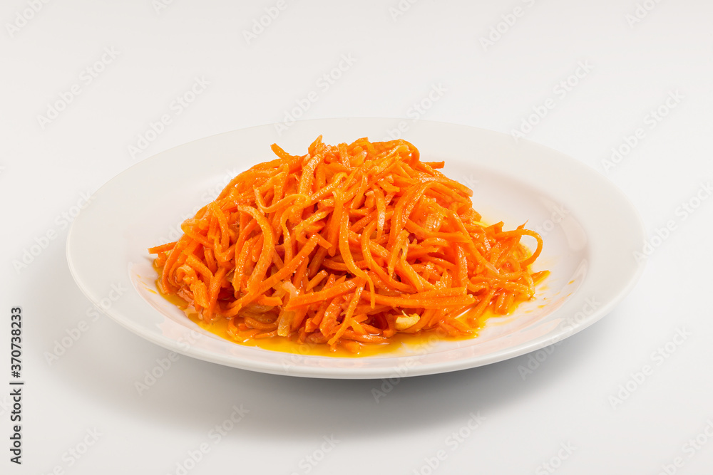 Korean carrot on a white plate Korean carrot on a white plate