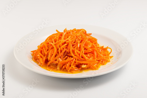 Korean carrot on a white plate