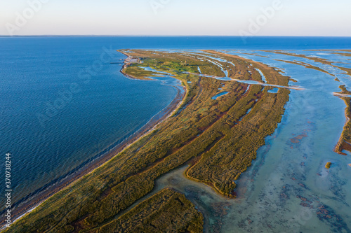 aerial view of autumn steppe on the island at sunset, aerial view of Dzharylgach island in autumn, aerial view of the lakes near the sea
