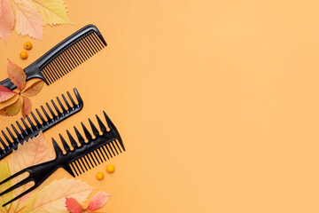 Professional hairdresser tools on orange autumn background