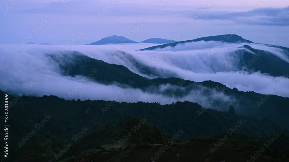 Time-lapse of cloud flowing over the mountain in the overcast day in summer in Nagano, Japan