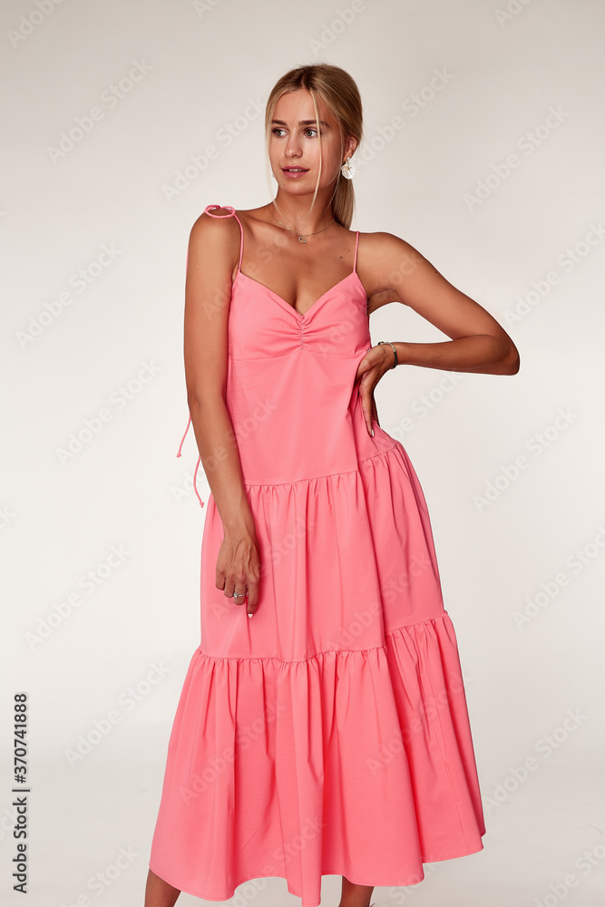 Beautiful woman fashion model makeup brunette hair perfect body shape tanned skin wear clothes summer collection organic long pink silk dress stylish sandals shoes, accessory jewelry earrings date. Beautiful woman fashion model makeup brunette hair perfect body shape tanned skin wear clothes summer collection organic long pink silk dress stylish sandals shoes, accessory jewelry earrings date.