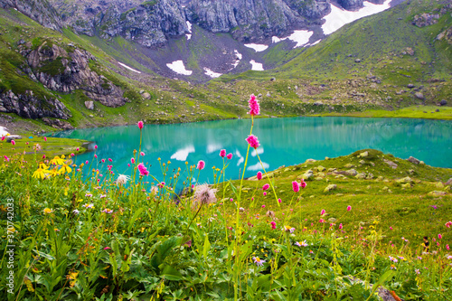 Alpine mountain lake landscape and view, blue beautiful and amazing lake panorama photo