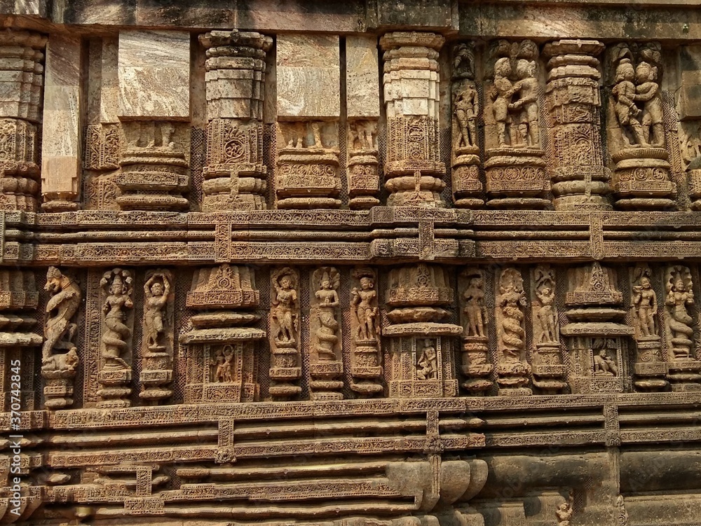 Sun Temple of Konark, India. Rock cut wall art on walls of the temple, sculptures of foreplay, mythical characters,and dance are carved out of stone. Sun Temple of Konark, India. Rock cut wall art on walls of the temple, sculptures of foreplay, mythical characters,and dance are carved out of stone.