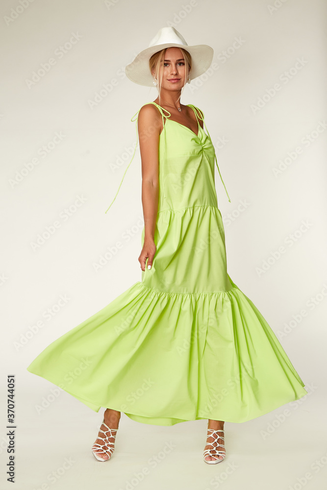 Pretty woman beautiful face bright makeup long blond hair fashion model wear trend clothes for date party summer walk travel cruise collection organic silk cotton dress accessory hat white studio. Pretty woman beautiful face bright makeup long blond hair fashion model wear trend clothes for date party summer walk travel cruise collection organic silk cotton dress accessory hat white studio.