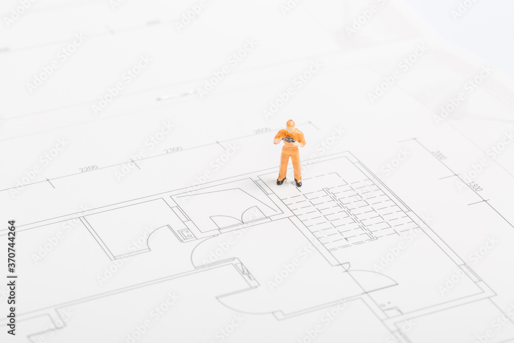 Building renovation drawings and miniature workers
Building renovation drawings and miniature workers