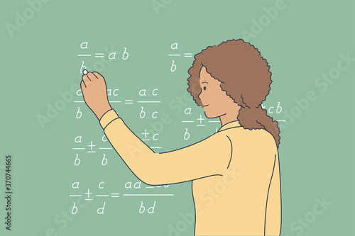 Education, school, study, solution, knowledge concept. Young pensive thoughtful african american schoolgirl child kid standing near blackboard and solving math equation with chalk. Educational process