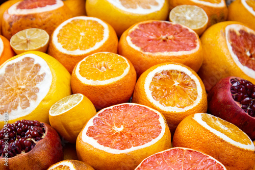 Image of orange and red fruits consisting of various fruits such as oranges  lemons and pomegranates.