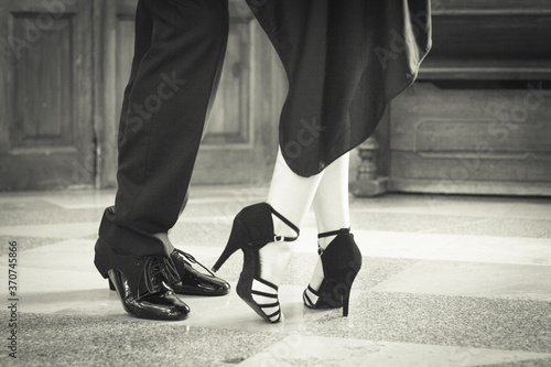 Legs of man and woman dancing Argentine tango