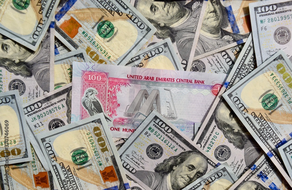 UAE National Banknote On Top Of USA National Currency Top View Of 