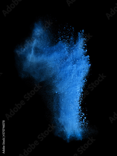 Freeze motion of blue dust explosion isolated on black background