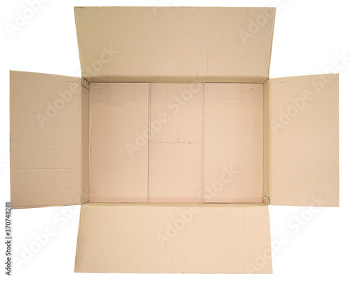 Close up view in the open lid of the empty brown big box isolated on white background © wuttichok