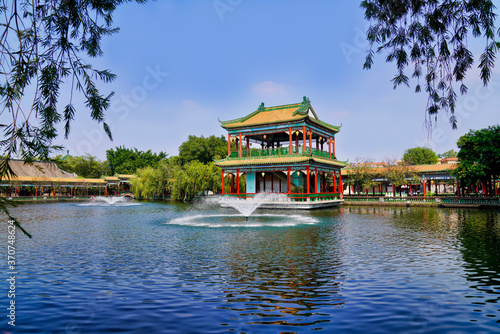 historic garden with traditional structures and popular water features filled with koi fish. Baomo park  Guangzhou China 