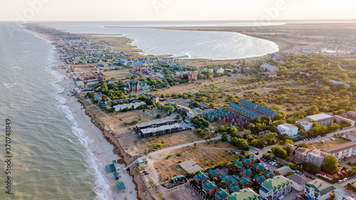 Aerial drone shot of the beach town with beautiful beach and ocean