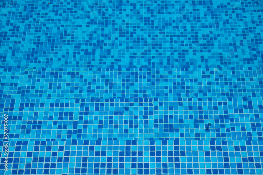 The blue tiled bottom background, of swimming pool. Cyprus The blue tiled bottom background, of swimming pool. Cyprus
