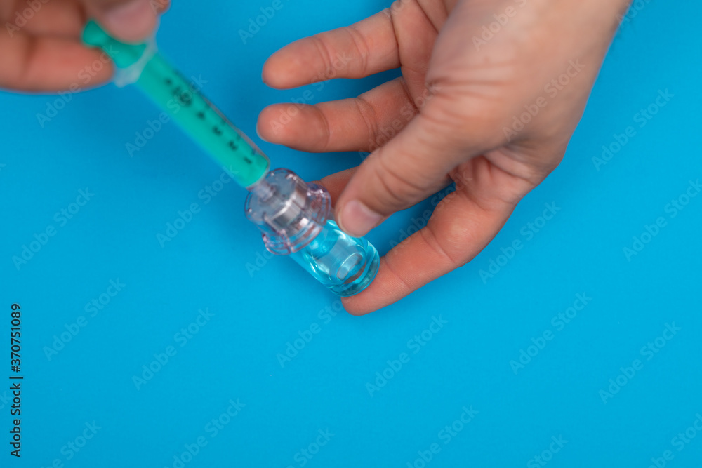 Close-up medical syringe with a vaccine concept. Close-up medical syringe with a vaccine concept.