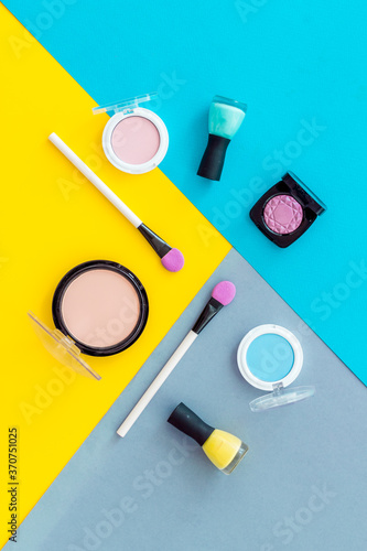 Flat lay of decorative cosmetics on color background. Above view