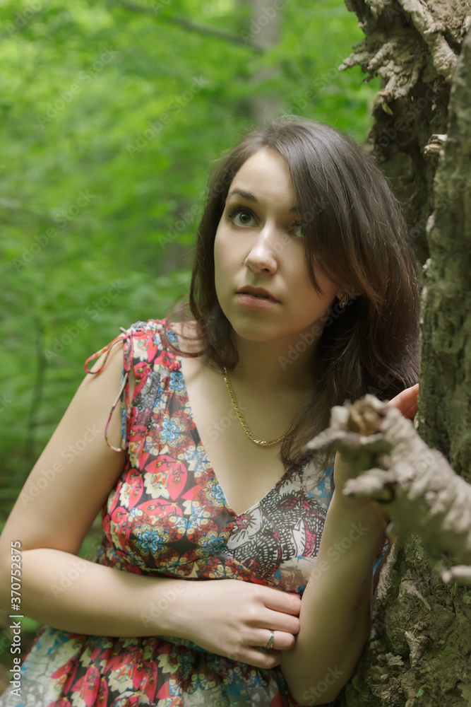 Naklejka premium Scared young woman a forest at night.