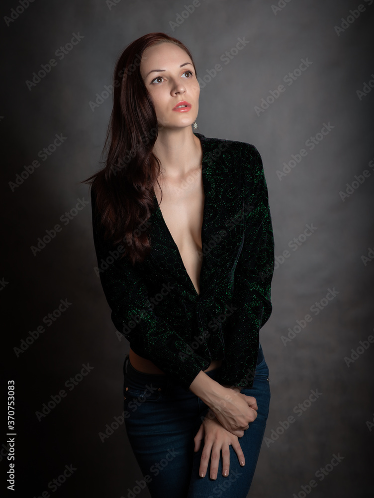 Portrait of beautiful sensual woman in green a jacket, close-up. Studio shot. Portrait of beautiful sensual woman in green a jacket, close-up. Studio shot.