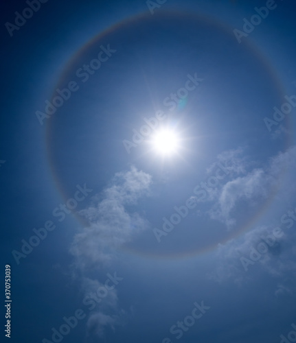 Rare phenomenon - sun halo in the blue sky.
