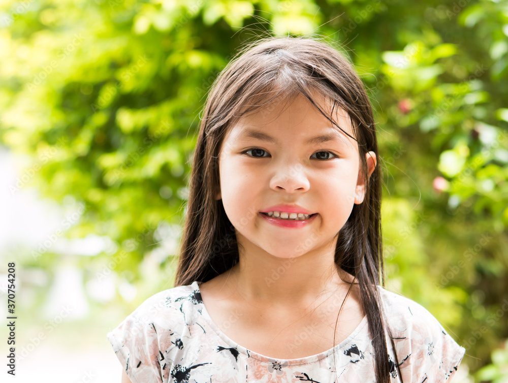little girl looking at camera , out door Chiangmai Thailand little girl looking at camera , out door Chiangmai Thailand