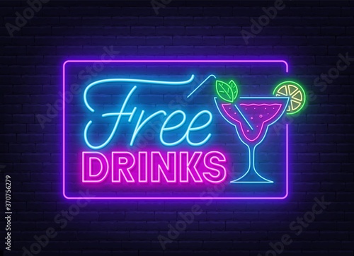 Free drinks neon sign on brick wall background .