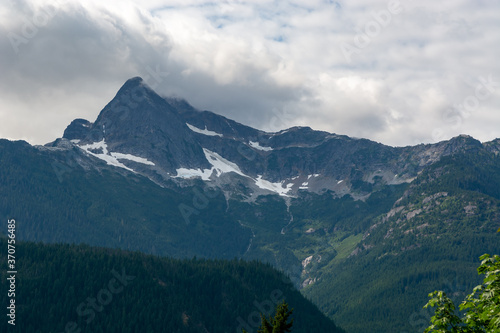 Cloudy mountain top peak at national park Northern Cascades Pacific Range Washington, USA