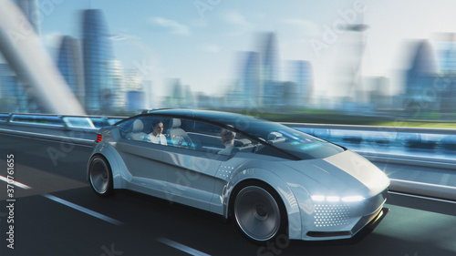 Shot of a Futuristic Self-Driving Van Moving on a Public Highway in a Modern City with Glass Skyscrapers. Female and Senior Man are Having a Conversation in Driverless Autonomous Vehicle. Motion Blur © Gorodenkoff