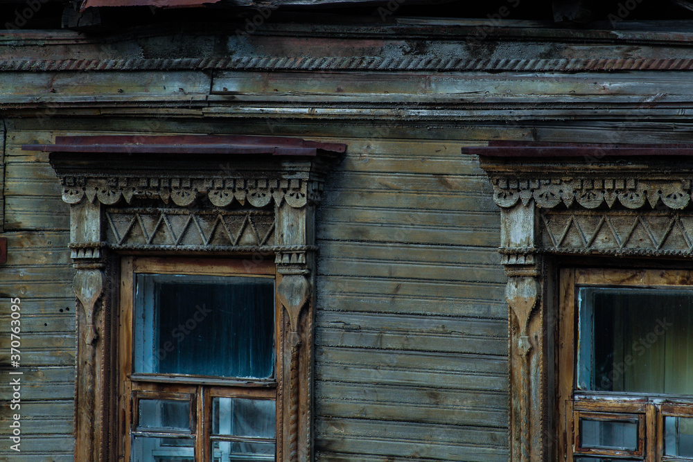 Roof of an old Russian house. Carved roof of an old house. The carving on the tree. Beautiful handmade patterns
