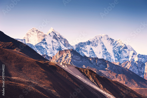 View of Kangtega mount in Himalaya mountains at sunrise. Khumbu valley, Everest region, Nepal. photo