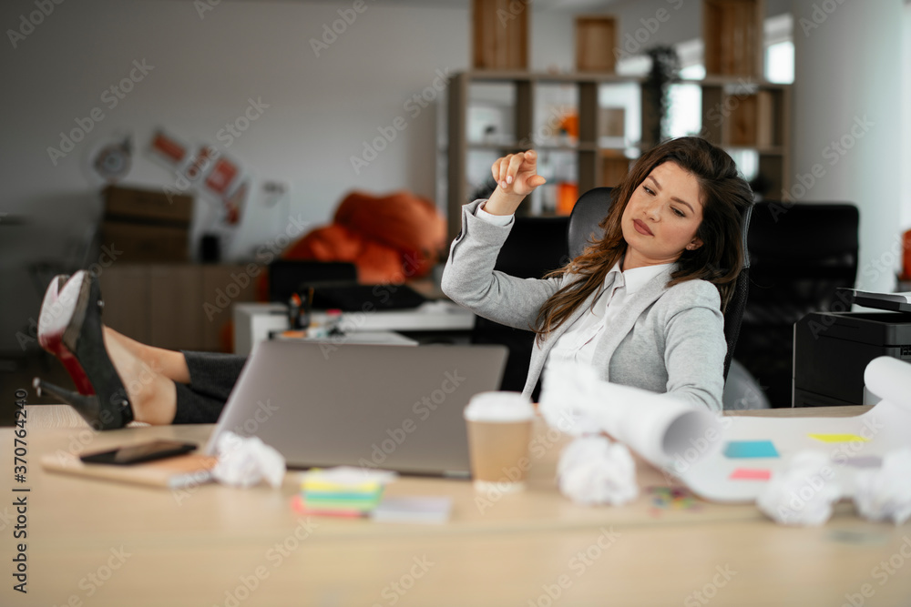 Businesswoman celebrating wining a new project. Beautiful woman working on project.. Businesswoman celebrating wining a new project. Beautiful woman working on project..