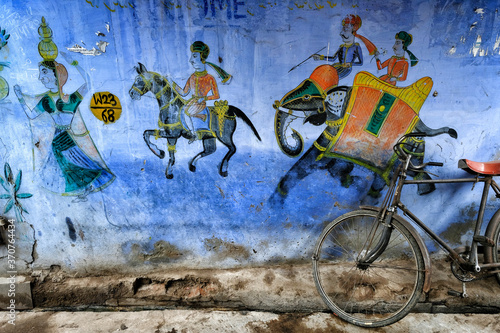 Bundi India - August 2020: A bicycle leaning against a traditional patterned wall on a street in the old town of Bundi on August 9, 2020 in Bundi, Rajasthan. India photo