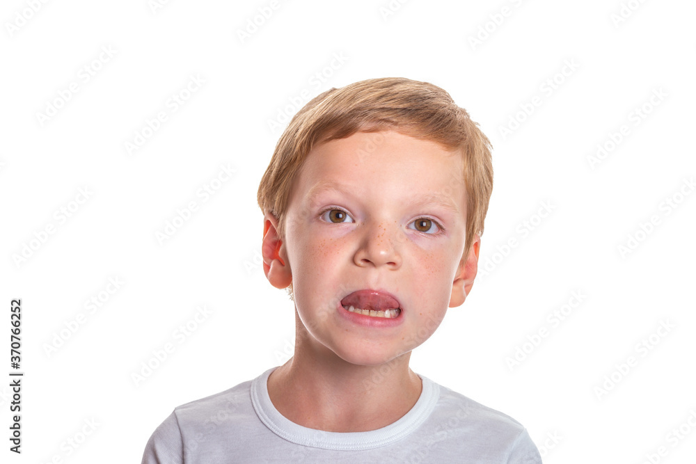 Speech therapy concept. Little boy doing exercises for correct pronunciation. Isolation on a white background. High quality photo Speech therapy concept. Little boy doing exercises for correct pronunciation. Isolation on a white background. High quality photo
