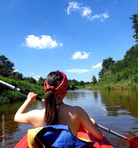 girl paddling on a kayak