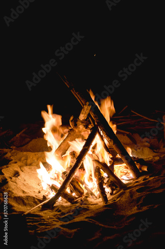 Inviting campfire on the beach at a warm summer night