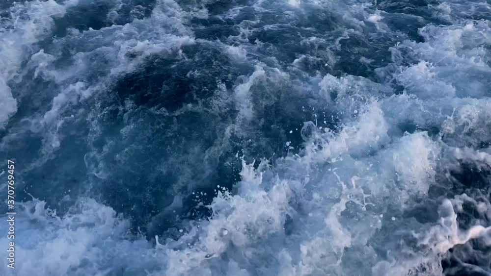 Powerful waves pulled out from the fast-moving boat. Water sport, summer holiday at sea concept. Powerful waves pulled out from the fast-moving boat. Water sport, summer holiday at sea concept.